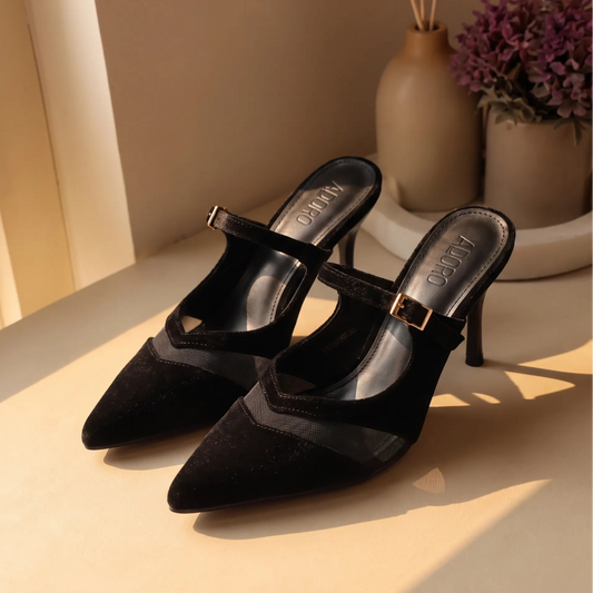 Pointed-toe court shoes with a sheer curved panel, buckle strap and open back.
