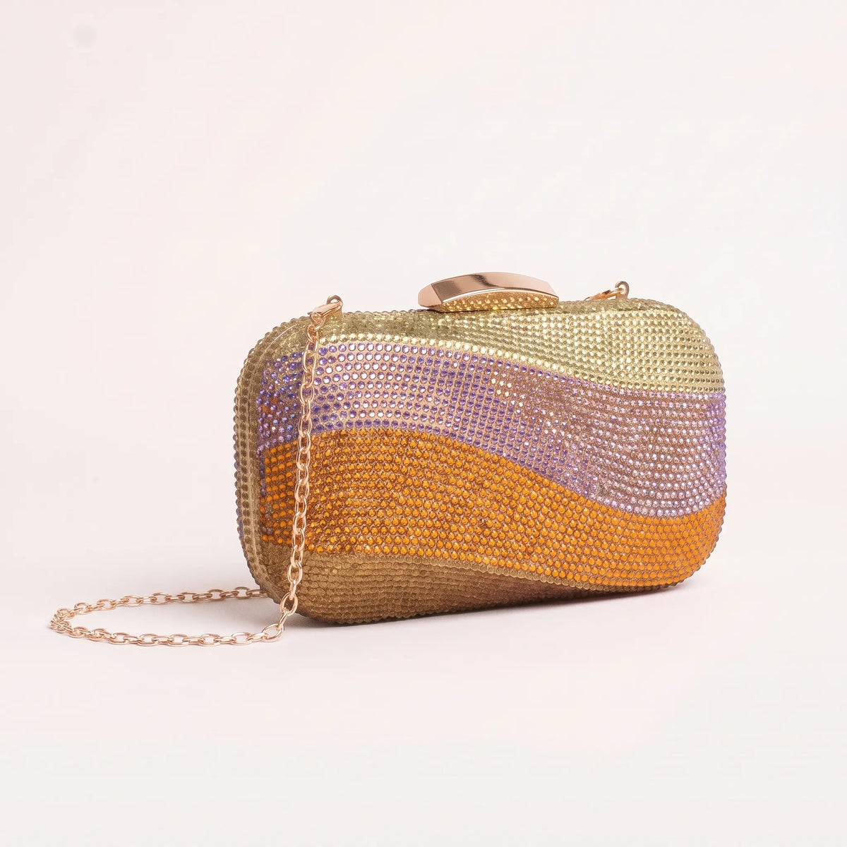 Rectangular clutch with wavy embellished bands, rounded corners and a curved clasp.